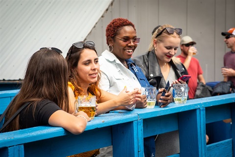 People enjoying music and drinks at ULLR Fest