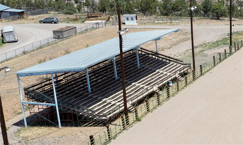 Photograph of an unoccupied grandstand at the Brewer Arena. 