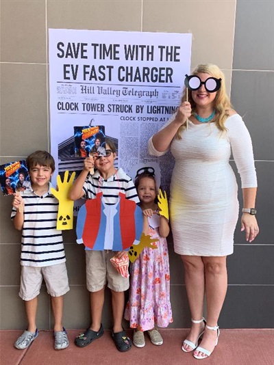 The Horner family enjoys the ribbon cutting photo booth